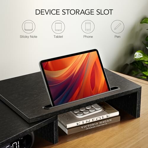 Device storage slot with tablet, phone, and books.