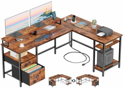 L-shaped desk with monitors, keyboard, and office supplies.