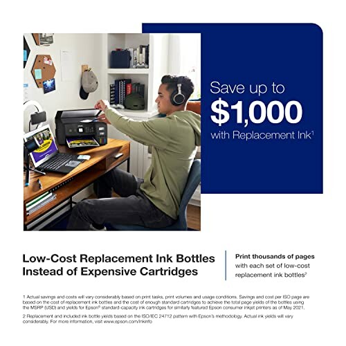 Man using computer with low-cost replacement ink bottles.